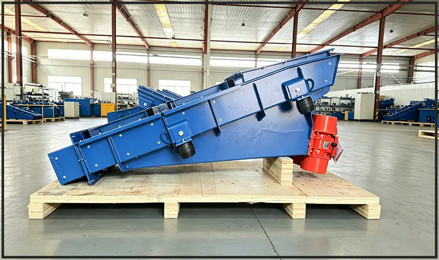 Motor vibrating feeder for glass industry, with red vibration motor and blue painted frame